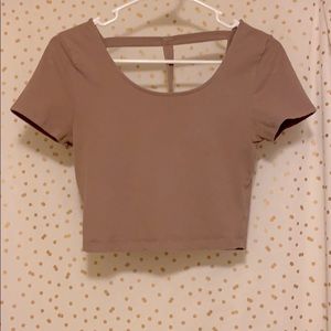 Light pink crop top with strap on back.